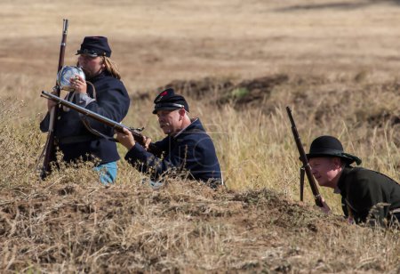 Photo for Union snipers take aim at a target during a Civil War Reenactment at Anderson, California. Photo taken on: September 27th, 2014 - Royalty Free Image
