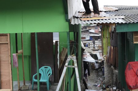 Téléchargez les photos : INDONÉSIE, Jakarta : Les habitants du quartier rouge de Kalijodo, dans le sous-district de Penjaringan à la frontière du nord et de l'ouest de Jakarta, sont vus le 26 février 2016 - en image libre de droit