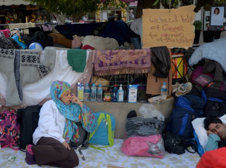 Photo for GREECE, Athens: Hundreds of refugees sleep in the street on Victoria Square, in the center of Athens, Greece, on march 1, 2016. Greek police does not allow them to travel due to the border lockdown with Macedonia. - Royalty Free Image