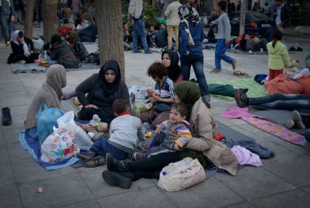 Photo for GREECE, Athens: Hundreds of refugees sleep in the street on Victoria Square, in the center of Athens, Greece, on march 1, 2016. Greek police does not allow them to travel due to the border lockdown with Macedonia. - Royalty Free Image