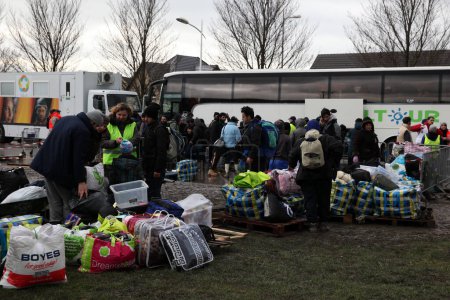 Photo for France, Grande-Synthe - March 7 2016: Refugees pictured during the dismantling of the migrants camp in Grande Synthe, near Dunkerque, northern France, - Royalty Free Image