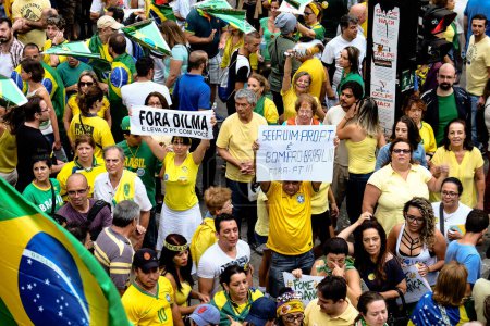 Photo for BRAZIL, Sao Paulo: Anti-government protestors jam Avenida Paulista during a demonstration calling for the removal of President Dilma Rousseff on March 13, 2016 in Sao Paulo, Brazil. - Royalty Free Image