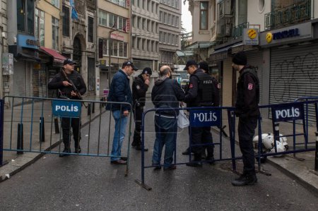 Photo for TURKEY, Istanbul: Police secure the area following a suicide bombing in a major shopping and tourist district at Istiklal street in the central part of the city on March 19, 2016 in Istanbul, Turkey - Royalty Free Image