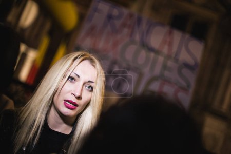 Photo for FRANCE, Paris: Inna Shevchenko poses attends a vigil in front of the Hotel de Ville, in Paris, as a tribute to the victims of Brussels following triple bomb attacks in the Belgian capital - Royalty Free Image