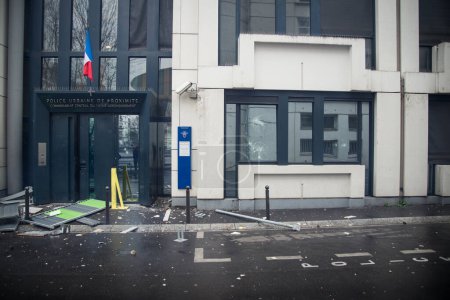 Photo for FRANCE, Paris: Policemen stand next a damaged police station, on March 25, 2016 - Royalty Free Image