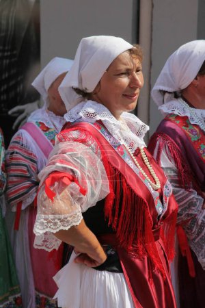Photo for People wearing croatian national costumes on the street - Royalty Free Image