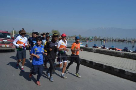 Photo for INDIA, Srinagar: Australian ultramarathon runner Pat Farmer completes his 4,400 kilometer run in Srinagar, Indian-administered Kashmir on March 29, 2016 - Royalty Free Image