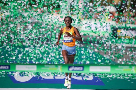 Photo for FRANCE, Paris - April 3, 2016: Kenyan Visiline Jepkesho passes the finish line during the 40th Paris Marathon in Paris. - Royalty Free Image