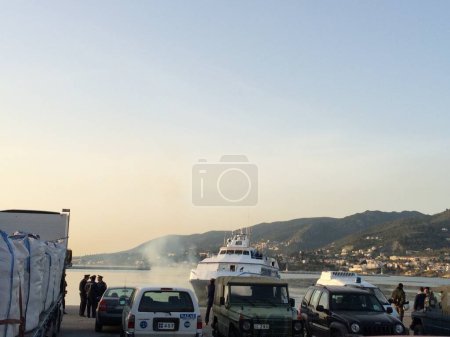 Photo for TURKEY, Dikili: Migrants who are deported from Lesbos and Chios islands in Greece to Turkey, arrive on April 4, 2016 in the port of Dikili, in Izmir district. - Royalty Free Image