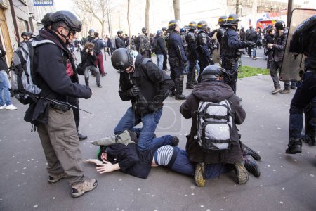 Photo for France, Paris - April 5, 2016: Clashes erupt between antiriot policemen and protesters in Paris. High school students demonstrate against government's planned labour law reforms for the fifth day - Royalty Free Image