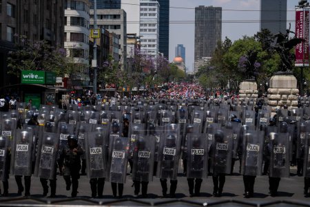 Photo for MEXICO, Mexico City: Hundreds march through Mexico City on April 11, 2016 the day following revolutionary Emiliano Zapata's death anniversary to draw attention to desires of several indigenous communities - Royalty Free Image