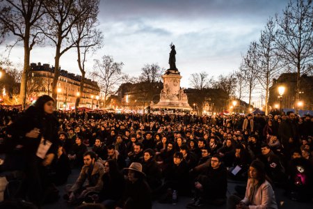 Photo for FRANCE, Paris: Hundreds of militants of the Nuit Debout or Standing night movement hold a general assembly to vote about the developments of the movement at the Place de la Republique in Paris on April 4, 2016 - Royalty Free Image