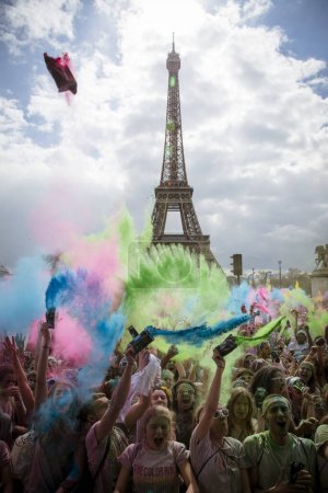 Photo for France: A volunteer throws colored pigments at participants of the Color Run by Sephora in Paris on April 17, 2016 - Royalty Free Image