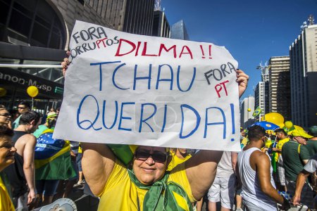 Photo for SAO PAULO, BRAZIL - MARCH 13, 2015: Large crowds of people protesting against Brazilian corruption and wanting the impeachment of president Dilma Rousseff and the removal of her political party - Royalty Free Image