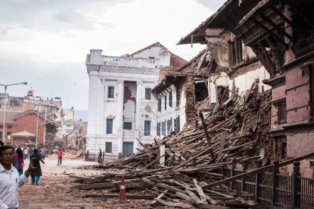 Photo for NEPAL, Kathmandu: People dig through the rubble in Kathmandu's Durbar Square on April 25, 2015 - Royalty Free Image