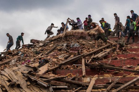 Photo for NEPAL, Kathmandu: People dig through the rubble in Kathmandu's Durbar Square on April 25, 2015 - Royalty Free Image