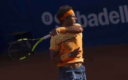 Photo for SPAIN, Barcelona: Spanish tennis player Rafael Nadal returns the ball to Japanese tennis player Kei Nishikori during the final of the ATP Barcelona Open Conde de Godo tennis tournament in Barcelona on April 24, 2015 - Royalty Free Image