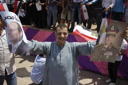 Photo for EGYPT, Giza: People wave national flags as they gather in Mostafa Mahmoud Square in Giza, near Cairo on April 25, 2016 to commemorate the thirty-fourth anniversary of Sinai liberation - Royalty Free Image
