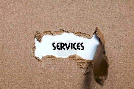 Photo for The word services appearing behind torn paper - Royalty Free Image