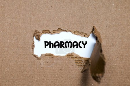 Photo for The word pharmacy appearing behind torn paper - Royalty Free Image