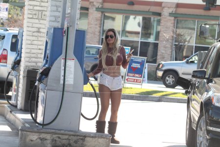 Photo for Ana Bragathe Brazilian Playboy Playmate spotted wearing tiny shorts and getting gas, Studio City, CA - Royalty Free Image