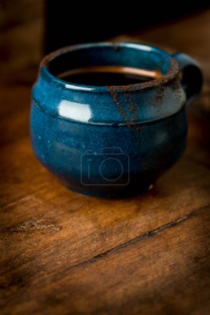 Photo for Coffee in grunge blue clay cup - Royalty Free Image