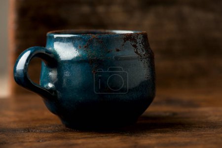 Photo for Coffee in grunge blue clay cup - Royalty Free Image