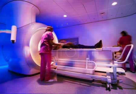 Photo for Doctor looking at mri scanner in hospital - Royalty Free Image