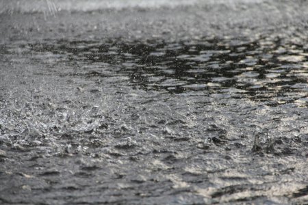 Photo for Heavy rain drops on ground - Royalty Free Image