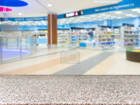 Photo for Empty table and shopping mall blu - Royalty Free Image