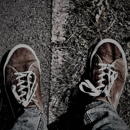 Photo for Man in shoes Staying on road - Royalty Free Image