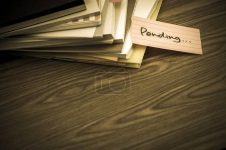 Photo for Pending The Pile of Business Documents on the Desk - Royalty Free Image