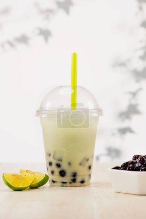 Photo for Lemon bubble boba tea with milk and tapioca pearls in plastic - Royalty Free Image