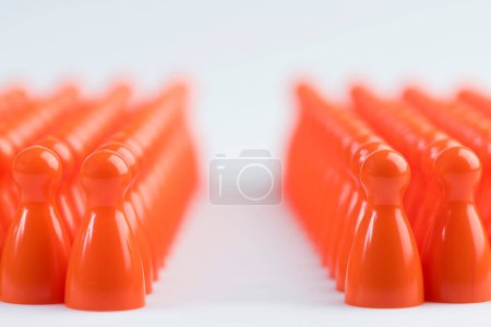Photo for Conceptual orange game pawns - Royalty Free Image
