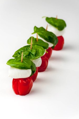 Photo for "insalada caprese on skewers on white " - Royalty Free Image
