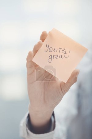 Photo for Hand holding sticker with words you are great - Royalty Free Image