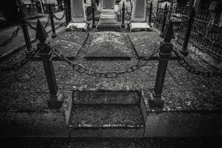 Photo for Old graves in a cemetery - Royalty Free Image