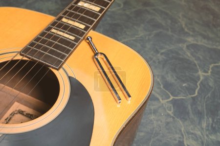 Photo for Acoustic guitar and diapason close up - Royalty Free Image