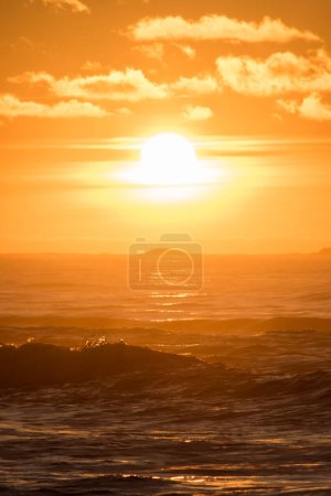 Photo for Sunset Hellst beach with lighthouse yellow red Norway - Royalty Free Image