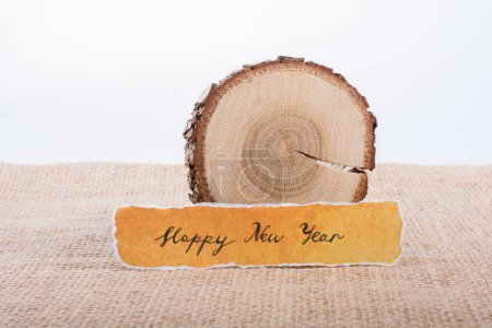 Photo for "Happy new year written on a torn paper" - Royalty Free Image
