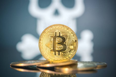 Photo for "Bitcoin fail concept, Golden bitcoin with skull and bones in the background." - Royalty Free Image