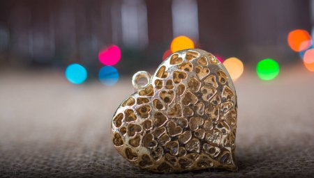 Photo for "Heart shaped gold color metal object " - Royalty Free Image