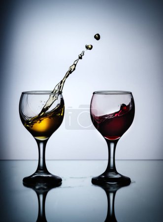 Photo for "stream of wine being pouring into a glass closeup" - Royalty Free Image
