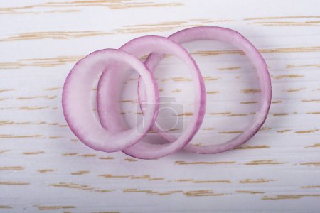 Photo for "Sliced onion rings and  onion slices  on background" - Royalty Free Image