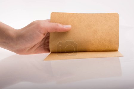 Photo for Hand holding a paper on white background - Royalty Free Image