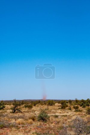 Photo for "Landspout whirlwind sand tornado dust devil in Australian dessert" - Royalty Free Image