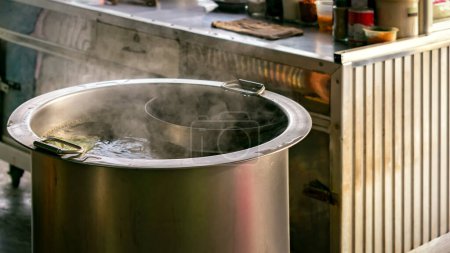 Photo for "Large Stainless Steel Pot with Soup" - Royalty Free Image