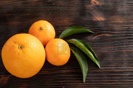 Photo for "top view of whole ripe tangerines scattered" - Royalty Free Image