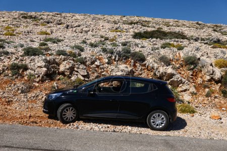Photo for Black car on the rocky road in Croatia, hot summer - Royalty Free Image