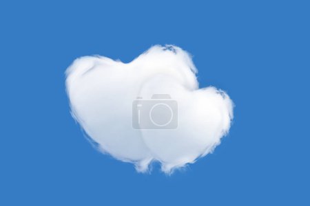 Foto de Dos nubes en forma de corazón aisladas sobre un fondo azul - concepto de amor y ternura - Imagen libre de derechos